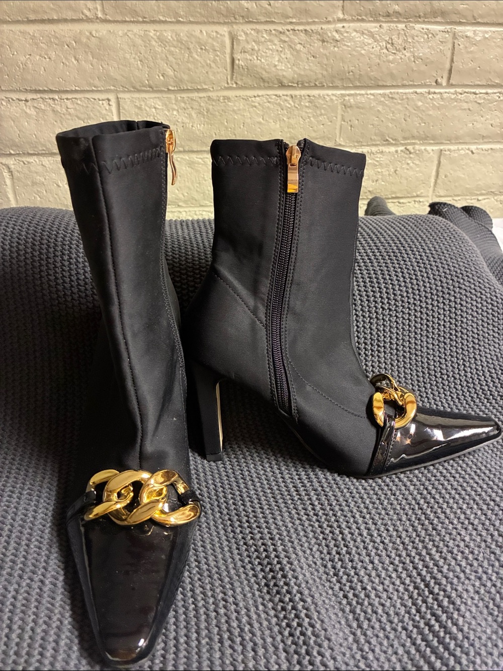 Black Pointed Toe Ankle Boots with Gold Chain Accent